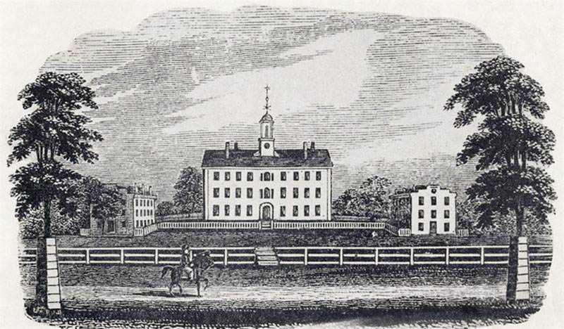 Historic sketch of a person on a horse riding in front of a three-story school building on a hill. 